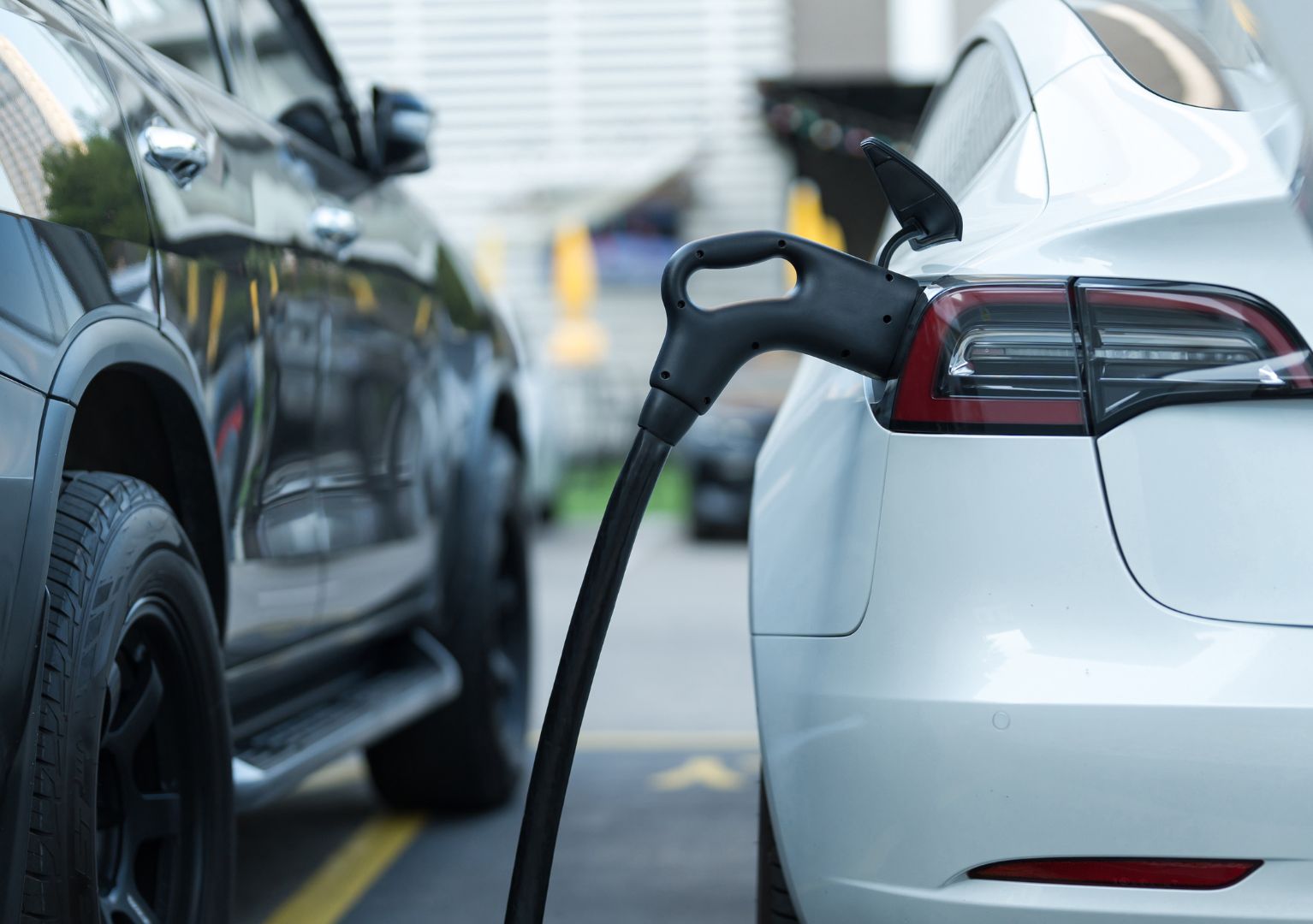 two cars with one being charged
